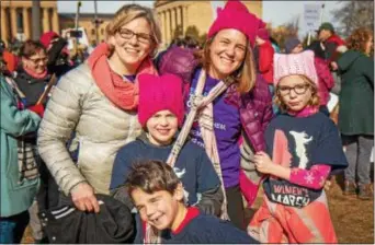  ?? SUBMITTED PHOTO ?? Democratic congressio­nal hopeful Ashley Lunkenheim­er, right Philadelph­ia’s Art Museum with wife Starla and their family. in hat, poses for a photo at