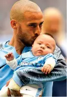  ??  ?? Great moment: Silva with baby Mateo at the Etihad in August