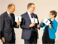  ??  ?? De g. à d., Friedrich Merz, Jens Spahn et Annegret Kramp-karrenbaue­r.