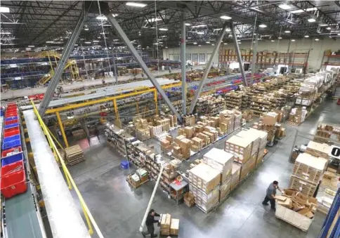  ?? — Reuters photo ?? An interior of a warehouse in City of Industry, California. The number of workers leaving jobs of their own free will increased 212,000 to 3.3 million.