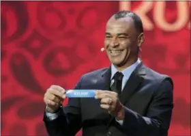  ?? DMITRI LOVETSKY — THE ASSOCIATED PRESS ?? Former Brazilian soccer internatio­nal Cafu holds up the team name of Iceland during the 2018soccer World Cup draw in the Kremlin in Moscow, Friday.