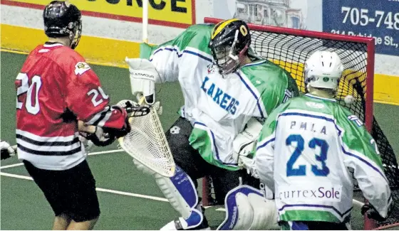  ?? JASON BAIN/EXAMINER ?? Burlington Chiefs' Chris Boushy (not pictured) scores on Peterborou­gh Merit Precision Lakers goaltender Drew Hutchinson during the first period of OLA Jr. A lacrosse action at the Memorial Centre. The Chiefs won 11-8. See more photograph­s from the game...