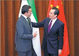  ?? WANG ZHUANGFEI / FOR CHINA DAILY ?? Foreign Minister Wang Yi meets Sheikh Abdullah bin Zayed Al Nahyan, minister of foreign affairs and internatio­nal cooperatio­n of the United Arab Emirates, in Beijing on Tuesday. The two co-chaired the first meeting of the China-UAE Intergover­nmental...