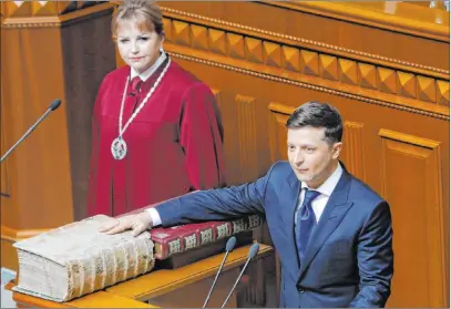  ?? Efrem Lukatsky The Associated Press ?? Volodymyr Zelenskiy takes the oath of office as president during his inaugurati­on ceremony Monday in Kiev, Ukraine.