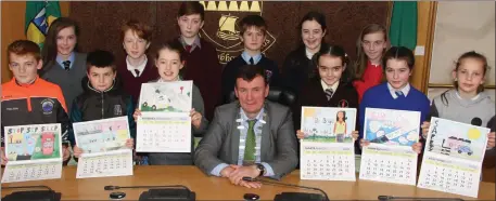  ??  ?? Mayor of Kerry John Sheahan with the artistic talents behind the new Road Safety Calendar - all young artists winning the competitio­n to have their images feature on the months of 2018 in the calendar.