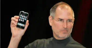  ?? AFP file ?? The late Steve Jobs during the unveiling of the original iPhone in San Francisco on January 9, 2007. The iPhone is behind the scenes a triumph of mining science, with a wide variety of raw materials and about 34 billion kg of mined rock as input to...