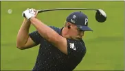  ?? MATT SLOCUM / ASSOCIATED PRESS ?? Bryson DeChambeau hits his driver at the practice area at Augusta National on Wednesday. “I can hit it as far as I want to, but it comes down to putting and chipping out here,” he said.