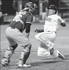  ?? ASSOCIATED PRESS ?? TONY DEJAK The Indians’ Michael Brantley scores on a sacrifice fly by Asdrubal Cabrera in the sixth inning.