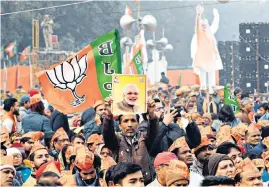  ??  ?? BJP supporters attend Narendra Modi’s rally in New Delhi yesterday