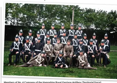  ??  ?? Members of No. 4 Company of the Hampshire Royal Garrison Artillery (Territoria­l Force). Blue ball helmets are being worn, some of the men wearing them with khaki service dress