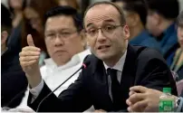  ?? AFP ?? Sanofi Pasteur-Asia Pacific head Thomas Triomphe gestures during a House of Representa­tives investigat­ion regarding the dengue vaccine costs in Manila on Monday. —
