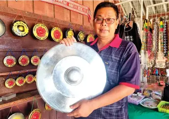  ?? — Bernama photo ?? Third-generation gong-maker Ronny Makuut says Kampung Sumangkap residents began making gongs in the 1950s following a village elder’s dream.