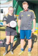  ??  ?? (Right): Elizabeth Laws receives a new football signed by the Football Ferns from Woodville Football Club President Troy Leggatt for playing the most hours — 15 — throughout the fundraiser.