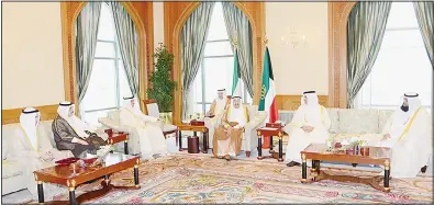  ?? Amiri Diwan photo ?? HH the Amir during his meeting with the National Assembly Speaker and members of the committee tasked with replying to the Amiri speech.