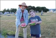  ?? SUBMITTED PHOTO — SUSAN LEIBY, FIRST REFORMED CHURCH ?? Pastor Inge Williams and Oliver Spatz with a freshly picked watermelon.