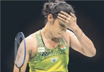  ?? AP ?? Saina Nehwal reacts after losing a point to Carolina Marin in a women's singles quarterfin­al at the BWF World Championsh­ips in Nanjing, China on Friday.