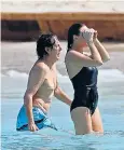  ??  ?? Sir Paul takes a dip with daughter Stella in St Barts. Below, his wife Nancy Shevell