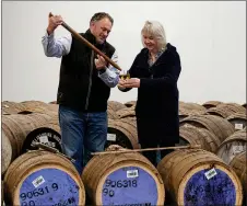  ?? ?? Rally ace Louise Aitken-Walker selects her whisky with master distiller David Robertson