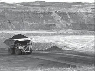  ?? The Associated Press ?? FOSSIL FUELS: A dump truck hauls coal Tuesday at Contura Energy’s Eagle Butte Mine near Gillette, Wyo.