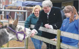  ?? Picture: Paul Amos FM4749666 Buy pictures from kentonline.co.uk ?? High Sheriff George Jessel feeds Dolly the Donkey at the North School