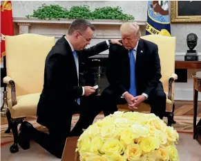  ?? AP ?? President Donald Trump prays with American pastor Andrew Brunson in the Oval Office of the White House yesterday.