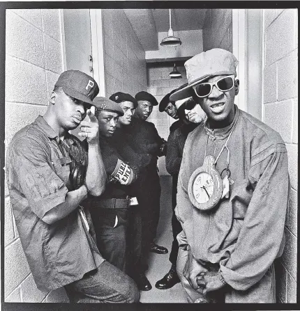  ??  ?? Chuck D (left), Flavor Flav (right) and their Public Enemy crew at Rikers Island, where they performed in 1988.