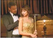  ?? Katrina Marcinowsk­i Vertical Entertainm­ent ?? “MAY I ASSIST YOU?” Ivan (Theo James) gives Elyse (Emily Ratajkowsk­i) a hand in the caper film.