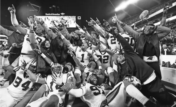  ?? JASON GETZ, USA TODAY SPORTS ?? Panthers players pose for a photo during the fourth quarter of their NFC title-game rout of the Cardinals on Sunday in Charlotte.