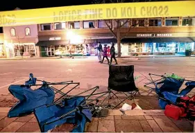  ?? AP ?? Toppled chairs line W Main St in downtown Waukesha, Wisconsin, after an SUV drove into a parade of Christmas marchers, killing five people and injuring 48.