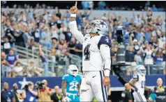  ?? [RON JENKINS/THE ASSOCIATED PRESS] ?? Cowboys quarterbac­k Dak Prescott celebrates his touchdown run against the Dolphins in the second half Sept. 22 in Arlington, Texas.