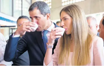  ??  ?? Venezuela’s opposition leader and self-proclaimed interim president Juan Guaidó and his wife Fabiana Rosales drink coffee, during a congress of agricultur­al producers, in Caracas, Venezuela, Wednesday, August 14, 2019.