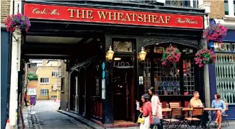  ??  ?? The Wheatsheaf pub was patronized by George Orwell, Dylan Thomas and Anthony Burgess. Orwell featured another London pub in his books “1984” and “Keep the Aspidistra Flying.” — IC