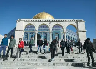  ?? (Ammar Awad/Reuters) ?? TOURISTS VISIT the Temple Mount earlier this month.