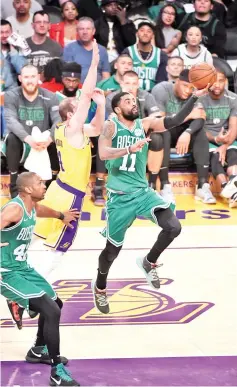  ??  ?? Kyrie Irving #11 of the Boston Celtics shoots the ball against the Los Angeles Lakers on March 9, 2019 at STAPLES Center in Los Angeles, California. - AFP photo