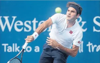  ?? JOHN MINCHILLO THE ASSOCIATED PRESS ?? Roger Federer ended weeks of speculatio­n this summer when he stepped onto the court wearing a Uniqlo shirt.