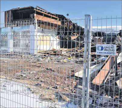  ?? CAPE BRETON POST ?? The wrecking ball hit this downtown landmark Tuesday morning. The building had several purposes over the years, from serving as home to Elman Motors to a hardware wholesaler and service station.