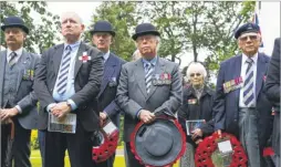  ?? Pictures: Andy Jones FM4406073/ FM4406095 ?? Mayor of Maidstone Cllr Derek Butler lays a wreath at a ceremony to mark the 100th anniversar­y of the start of the Battle of The Somme as the congregati­on pay their respects