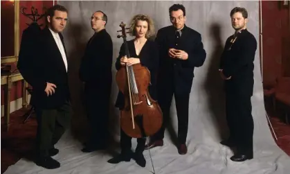  ?? ?? ‘We shared a love of football and cake’ … Elvis Costello, second from right, with the Brodsky Quartet in 1993. Photograph: Paul Massey/Rex Features