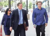  ?? GETTY IMAGES ?? Marcus Hutchins (right), the British cybersecur­ity expert accused of creating and selling malware that steals banking passwords, arrives at the federal courthouse in Milwaukee.