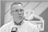  ?? AP Photo/Michael Conroy ?? ■ Cleveland Browns general manager John Dorsey speaks during a press conference at the NFL football scouting combine Thursday in Indianapol­is. Dorsey is willing to take trade offers for the No. 1 overall draft pick. He’s even encouragin­g teams to make...