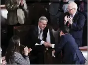  ?? HAIYUN JIANG — THE NEW YORK TIMES ?? Rep. Kevin McCarthy, R-Bakersfiel­d, shakes hands with Rep. Mike Johnson, R-La., after voting for Johnson during the election for House speaker last week.