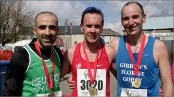  ??  ?? 10K winners: Iosif Guther (2nd), Niall Sheil (1st) and Paul Gibbons (3rd).