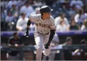  ?? DAVID ZALUBOWSKI — THE ASSOCIATED PRESS ?? The Giants’ Mauricio Dubon heads up the first base line after hitting a double off Colorado Rockies starting pitcher Kyle Freeland in the second inning Monday in Denver.