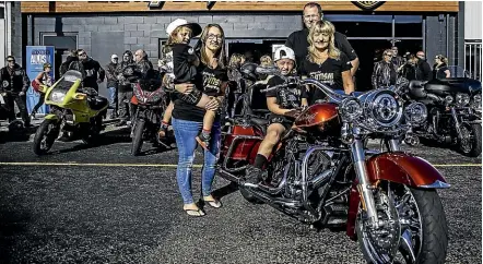  ?? DAVID UNWIN/STUFF ?? Sarah Blythe has organised a motorcycle ride to raise thousands of dollars to send teachers from around the region to an autism awareness course. Sarah Blythe, Mataeo Blythe, 4, Neko Blythe, 7, Blair Worsley, and Deb Costello shortly before the motorcycle ride began.