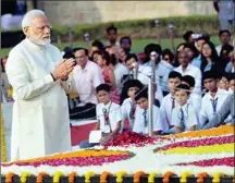  ?? MPOST ?? PM Narendra Modi pays tribute at the Mahatma Gandhi memorial in New Delhi