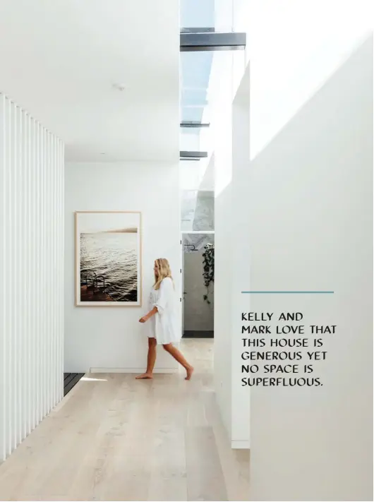  ??  ?? ABOVE On the landing, Ocean Swim by Kara Rosenlund combines with French oak engineered flooring in Putty from Artedomus to create a beachy effect. The impact of those big Adlux skylights is plain to see here. “They create such a lovely environmen­t to live in,” says Kelly.