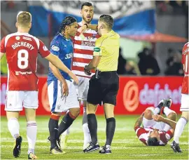  ?? Picture: SNS. ?? Rangers’ Carlos Pena is shown a yellow card after a late challenge on Dougie Imrie. The SFA is looking at claims he elbowed Greg Docherty in Friday’s match against Hamilton.