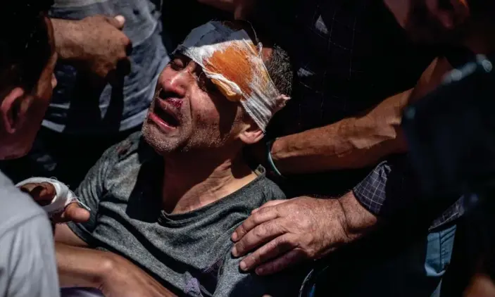  ?? Photograph: Fatima Shbair/Getty Images ?? A Palestinia­n survivor mourns his children who were killed in an Israeli raid in the central Gaza Strip.