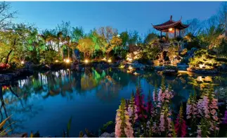  ??  ?? A traditiona­l southern Chinese garden at the Guangdong Pavilion with a pond and artificial hill.