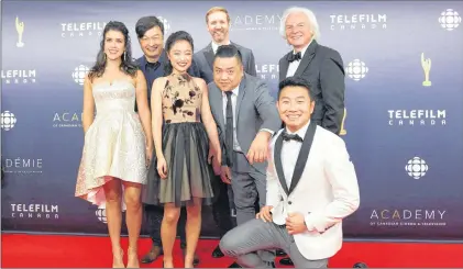  ?? CP PHOTO ?? Posing on the red carpet is the group from Kim’s Convenienc­e, including producer Ivan Fecan, back right, at the 2017 Canadian Screen Awards in Toronto on March 12. What do you do if your new Canadian sitcom strikes gold its very first season, becoming...